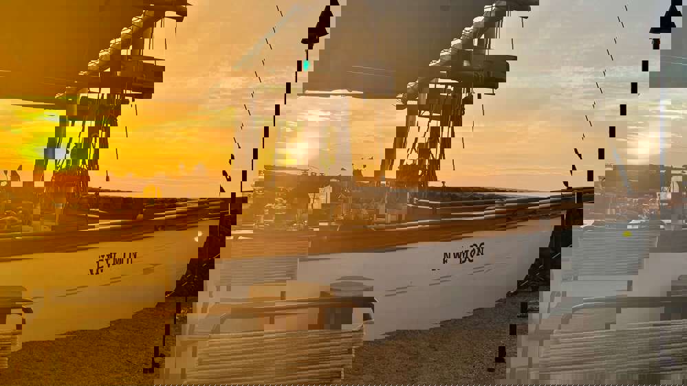 Golden hour by the beach, complete with a quiet boat ride
